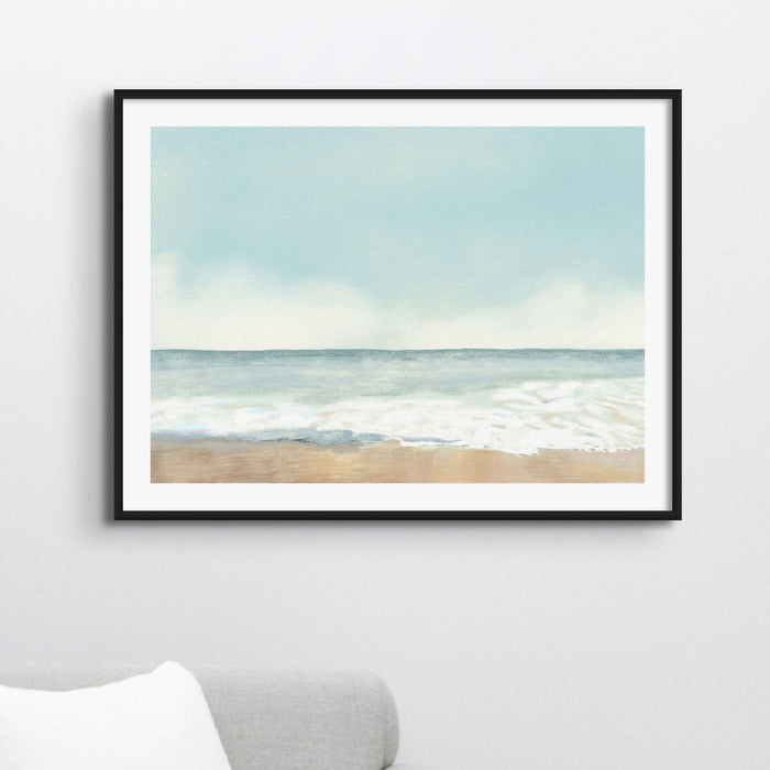 Framed pastel seascape art print in neutral interior, soft coastal wall art with beach scene