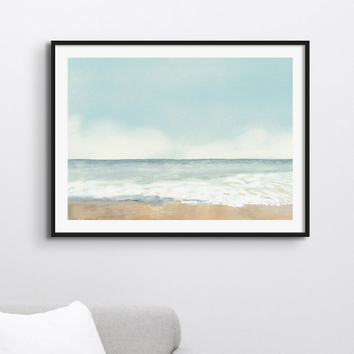 Framed pastel seascape art print in neutral interior, soft coastal wall art with beach scene