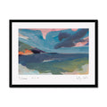A framed abstract landscape painting of Porthmeor beach in Cornwall. Featuring textured brushstrokes of blue, green, pink, and orange, presented in a black frame with a white mat on a light grey background.