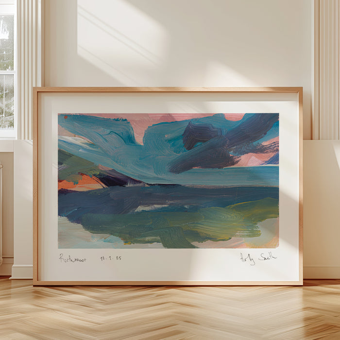 A framed abstract landscape painting with blue, green, pink, and orange brushstrokes, displayed on a light wood floor in a bright room with two windows and cream-colored radiators.