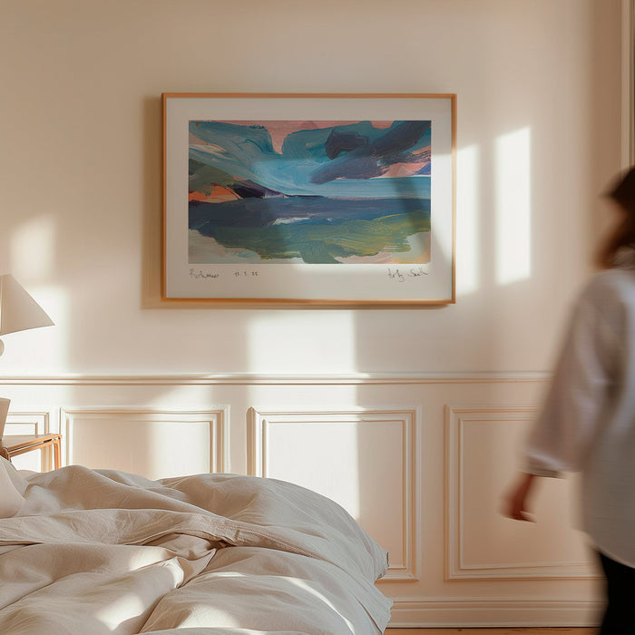 A framed abstract landscape painting of Porthmeor beach in Cornwall in bedroom on wall above panels. Featuring textured brushstrokes of blue, green, pink, and orange, presented in a black frame with a white mat on a light grey background.