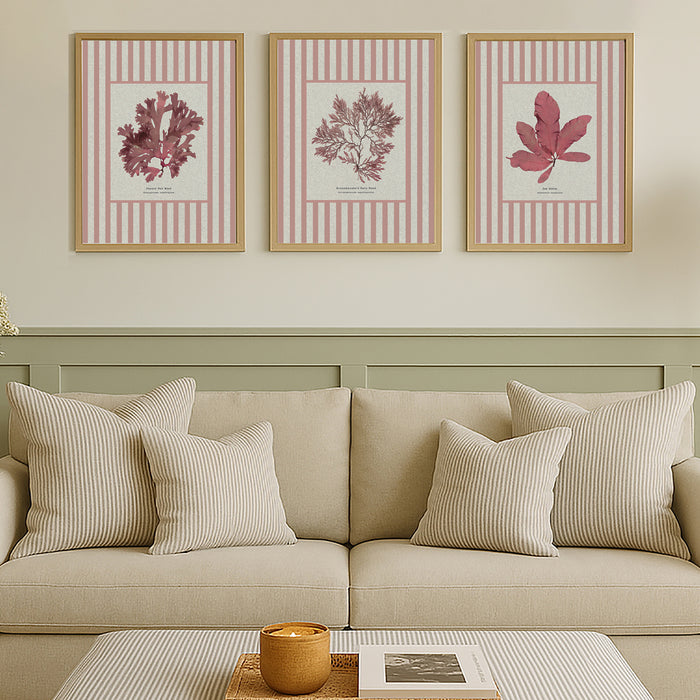 Set of three striped seaweed print on wall in neutral living room.