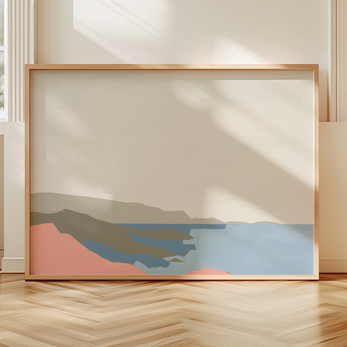 Framed abstract artwork on a wall with natural light casting shadows.