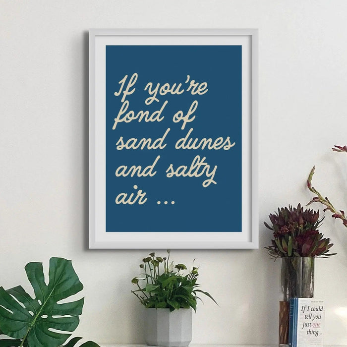 Coastal word art print of 'Salty Air' in marine colour on wall - coastal wall art