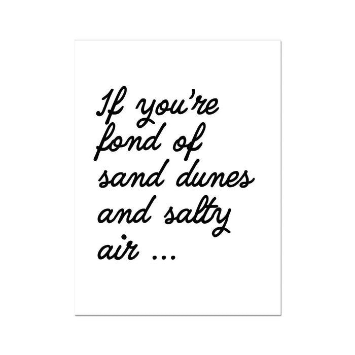 A black and white typography art print with the text: 'If you're fond of sand dunes and salty air...' displayed.