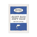 A vintage style book cover art print with the title 'SALTY HAIR DON'T CARE BEACH LOVER' and a small graphic of a dolphin. The background is blue with white and darker blue stripes.