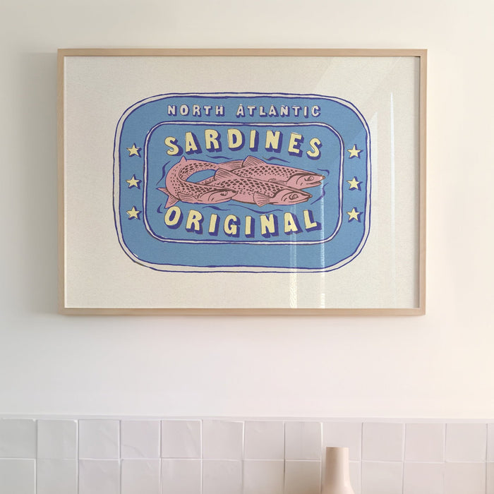 Painting of sardine tin framed on wall in kitchen