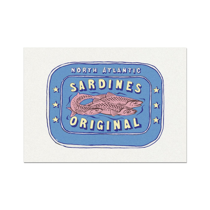 A framed print of a sardine tin with bold red and yellow colors on a blue background, with the text 'Sardines Original' and 'North Atlantic'.
