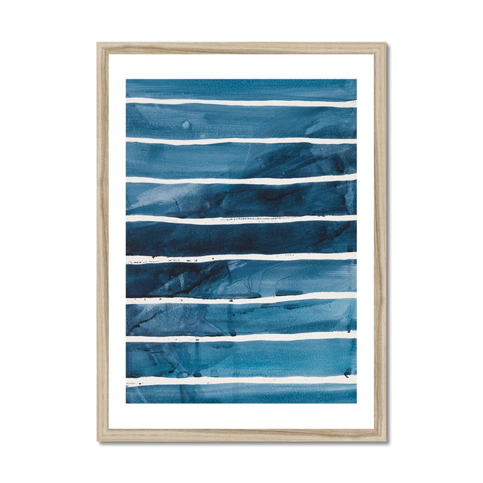 A framed abstract painting featuring horizontal indigo blue watercolor stripes, presented in a simple, clean wooden frame.