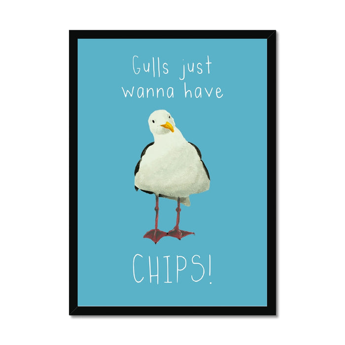 Seagull art print featuring a painted seagull on a blue background with the quote “Gulls just wanna have chips”, framed in a black wood frame.