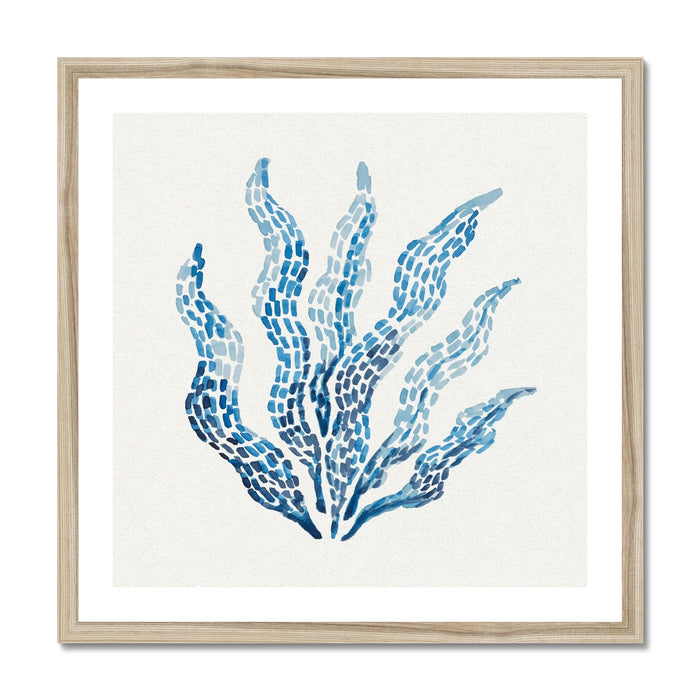 Framed artwork of blue seaweed design on a white background