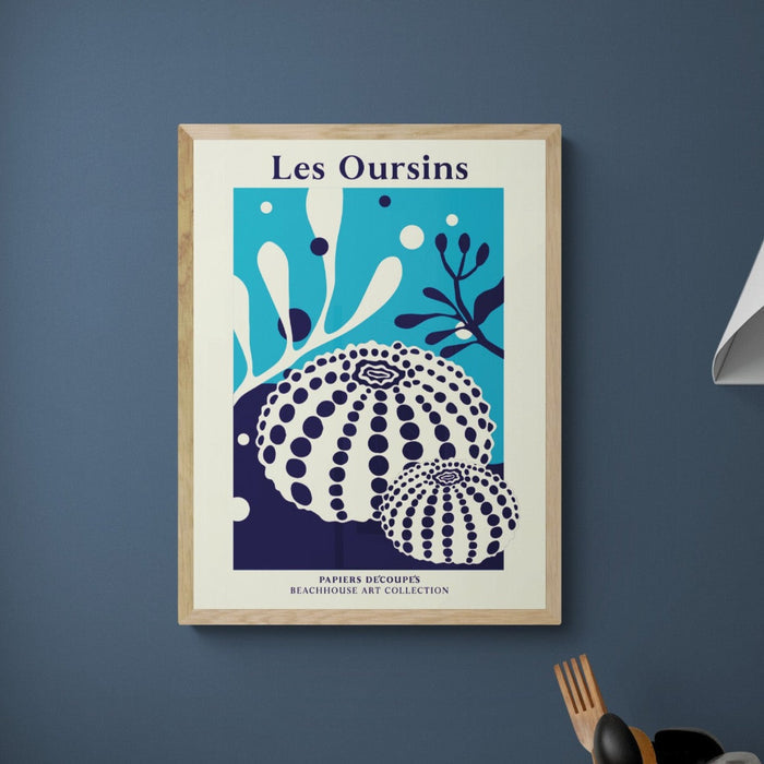 a graphic coral art print framed on wall with wooden frame.