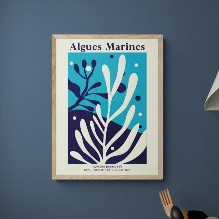 a graphic seaweed art print framed on the wall with a wooden frame.