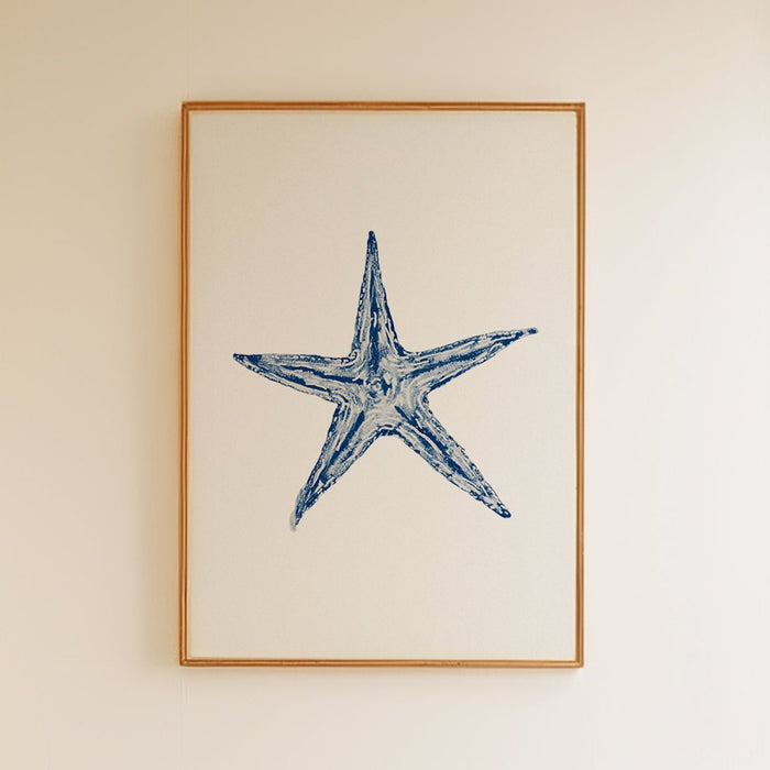starfish painting framed on wall in natural frame