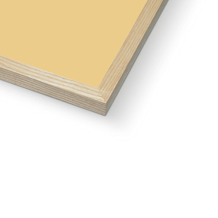 Close-up of a yellow sheet of paper with wooden edges on a white background