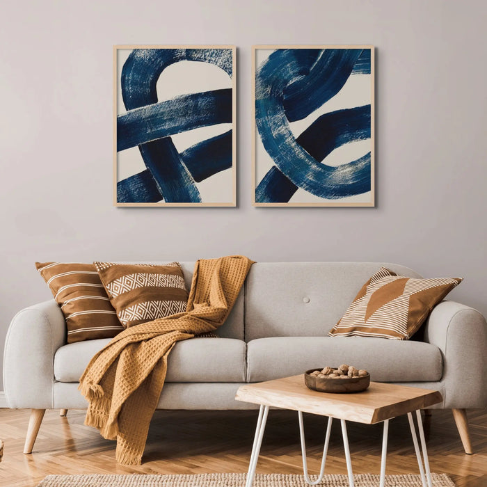 set of two knot art prints above a sofa