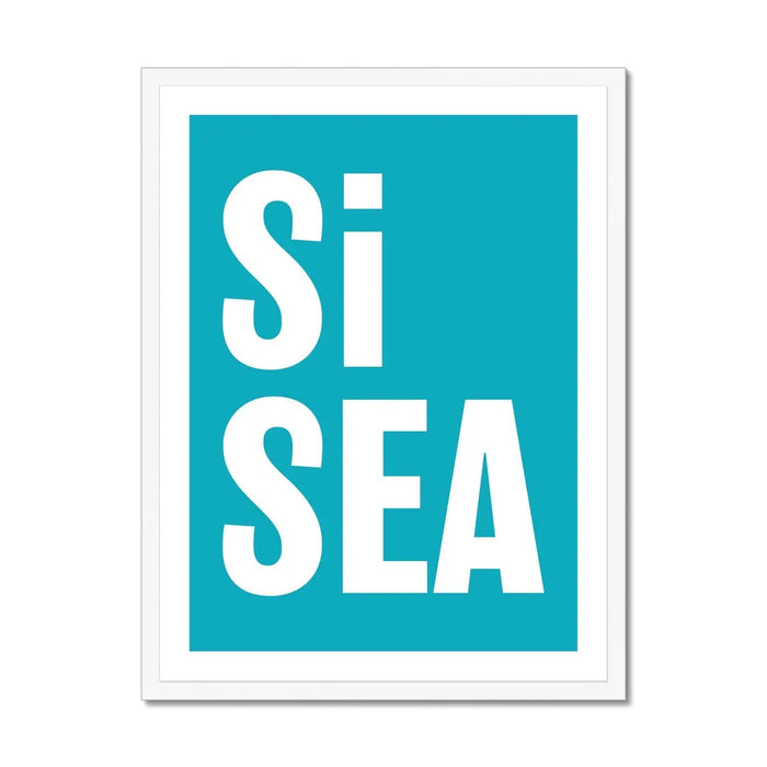 A framed typography art print with the words 'Si Sea' in large white letters on a teal background, framed in a simple white frame.