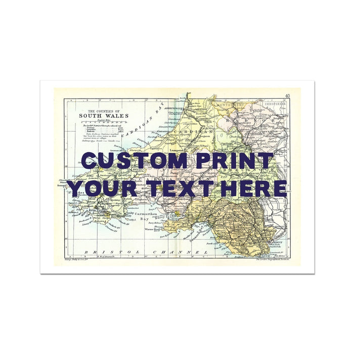 A custom map print of South Wales with a navy hand-drawn font, showcasing various places such as Pembrokeshire, the Mumbles, Swansea, and Cardiff. The image has a sample custom text placeholder saying 'CUSTOM PRINT YOUR TEXT HERE'.