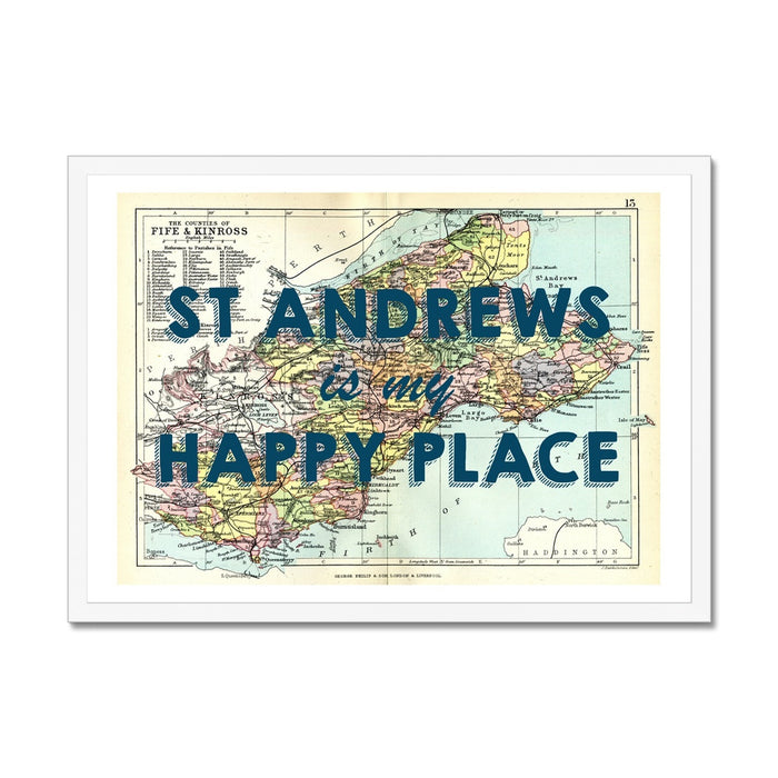 Framed vintage map print of St Andrews featuring text 'St Andrews is my Happy Place' on a colourful map background, encased in a white frame.