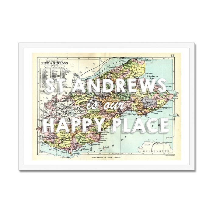 Framed vintage map print of St Andrews featuring text 'St Andrews is my Happy Place' on a colorful map background, encased in a black frame.