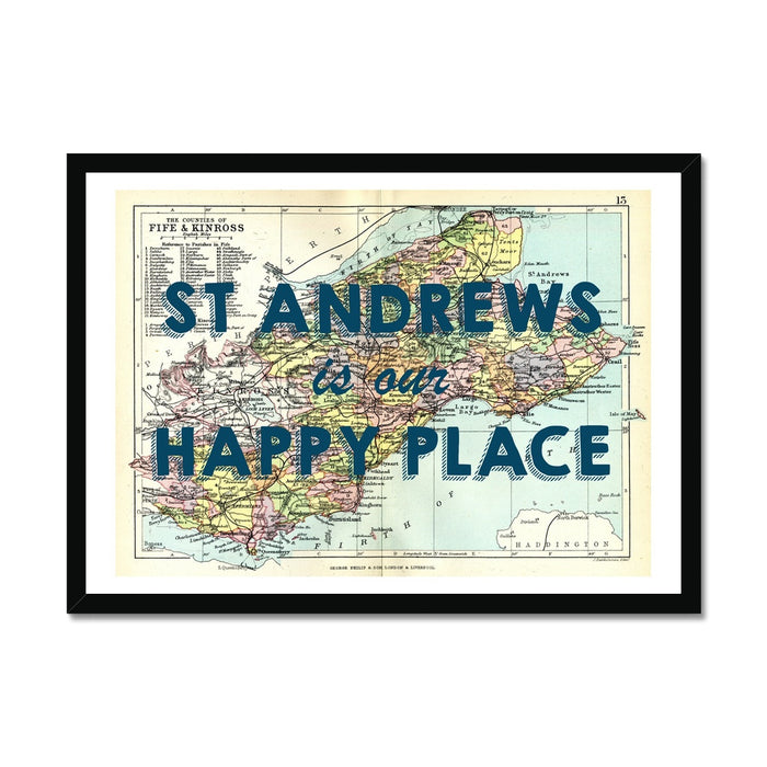 Framed vintage map print of St Andrews featuring navy typography on a colorful map background, within a black frame.