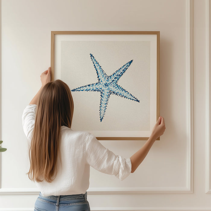 framed starfish painting on wall in panelled livingroom