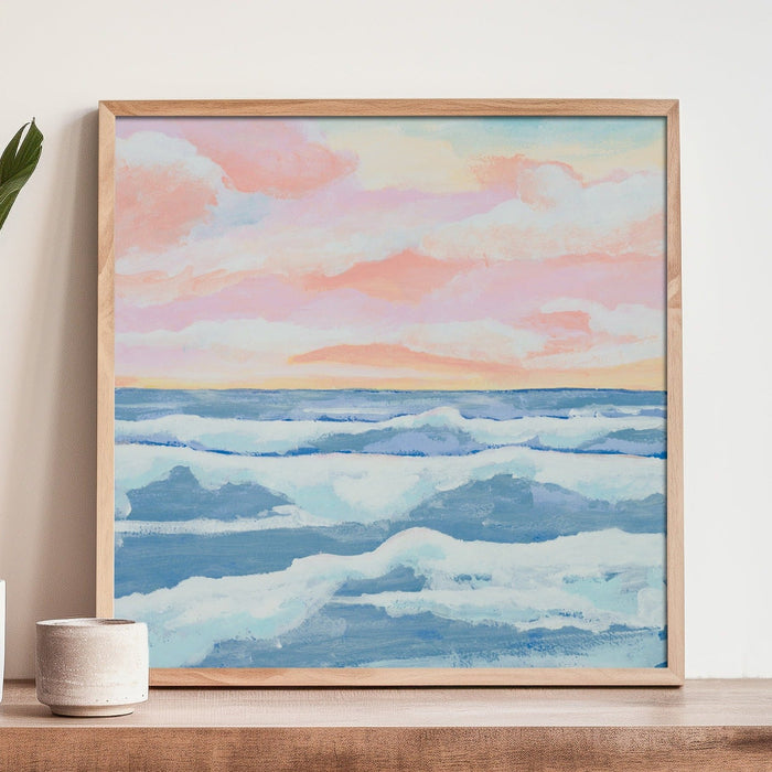 Pink and blue seascape painting with soft sunrise sky over ocean waves, coastal wall art print framed with natural frame