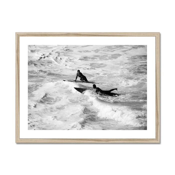 black & white photograph of two surfers in the surf in a natural frame - beach house art