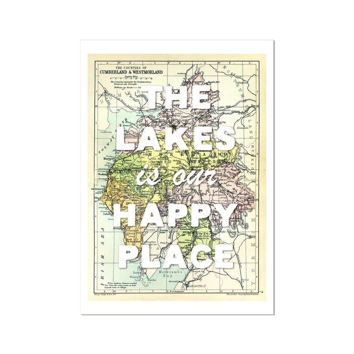 A framed Lake District vintage map print with the text 'The Lakes is our Happy Place' overlaid on it.