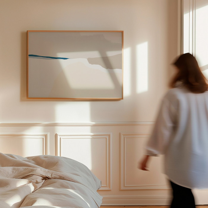 Woman walking in a bedroom with a large abstract painting on the wall