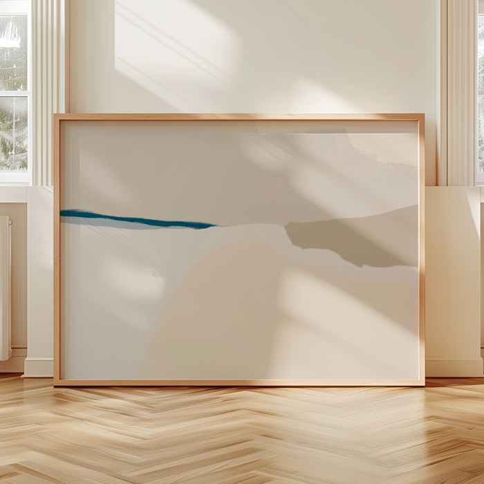 Abstract coastal art piece in a wooden frame on a light-colored wall.