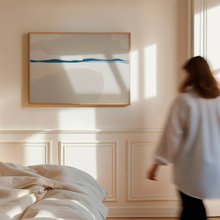 Woman walking in a bedroom with abstract art on the wall