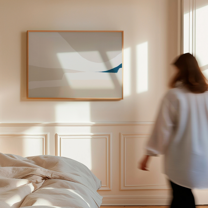 Woman walking in a bedroom with a large abstract painting on the wall