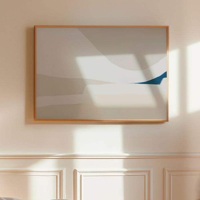 Abstract beach painting with a wooden frame on a wall