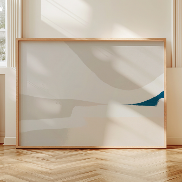 Framed abstract artwork on a wall with a wooden floor