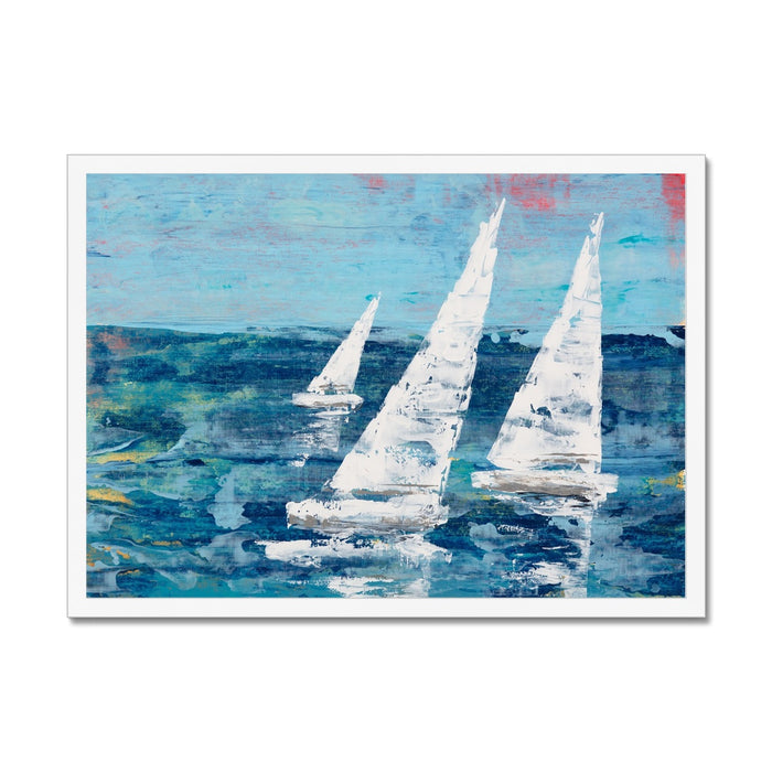 Sailing art print of three white sailboats, framed on wall with white frame.