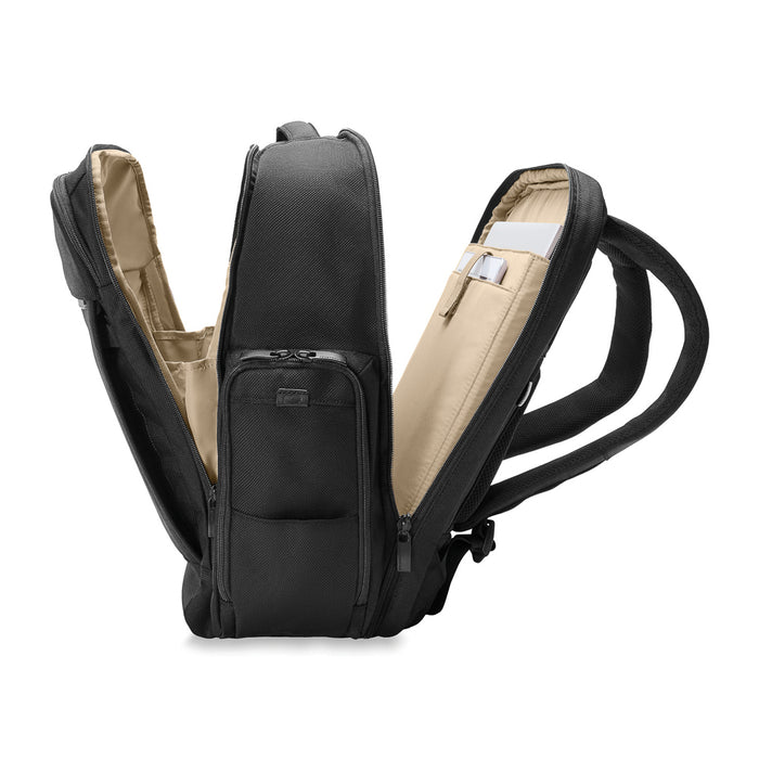 Black Briggs & Riley Baseline 2 Travel Backpack with multiple compartments and ergonomic straps, ideal for travel.
