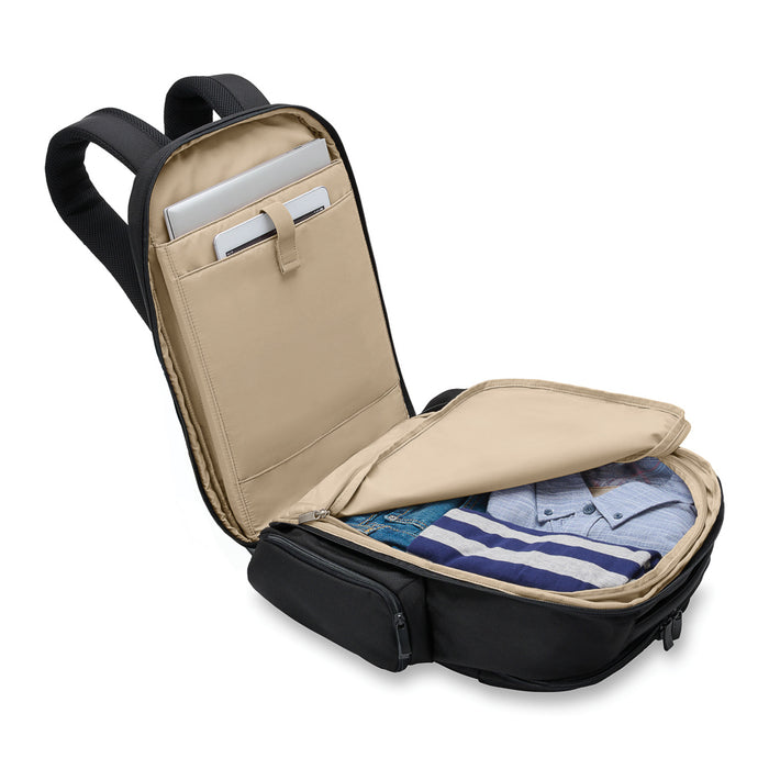 Black Briggs & Riley Baseline 2 travel backpack with multiple compartments and padded straps on a white background.