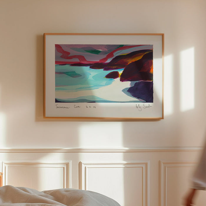 A framed abstract landscape art print hangs on a cream-colored wall in a sunlit bedroom. A woman in a white shirt walks past the window on the right, and a bed with rumpled white bedding is visible in the foreground.