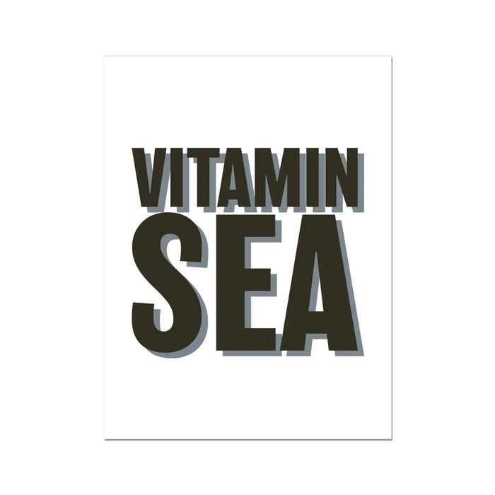 A black and white typography art print with the words 'VITAMIN SEA' in bold letters, presented on a white background.