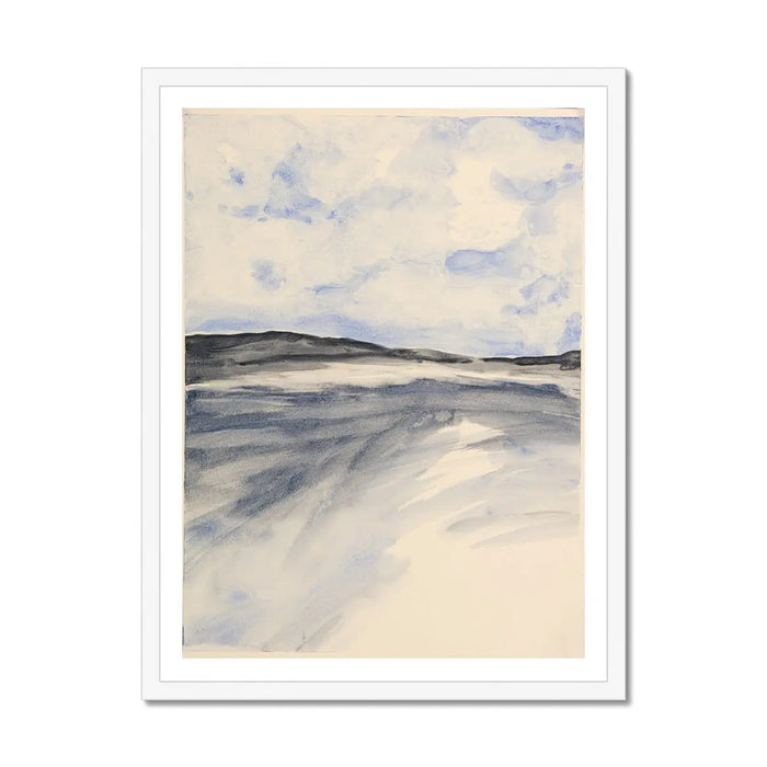 A framed watercolour painting depicting a coastal landscape with blue sky and clouds over a misty bay, set in a white frame.