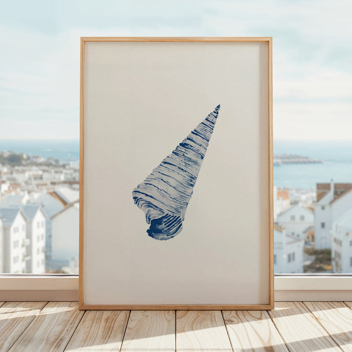 A navy blue watercolour print of a cone shell on a white background on a window shelf.