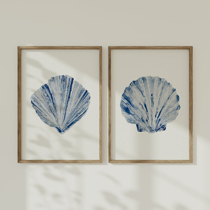 A set of two shell paintings on white wall.