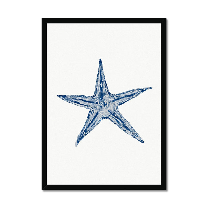 Framed watercolour art print of a blue starfish on a white background, housed in a simple black frame.