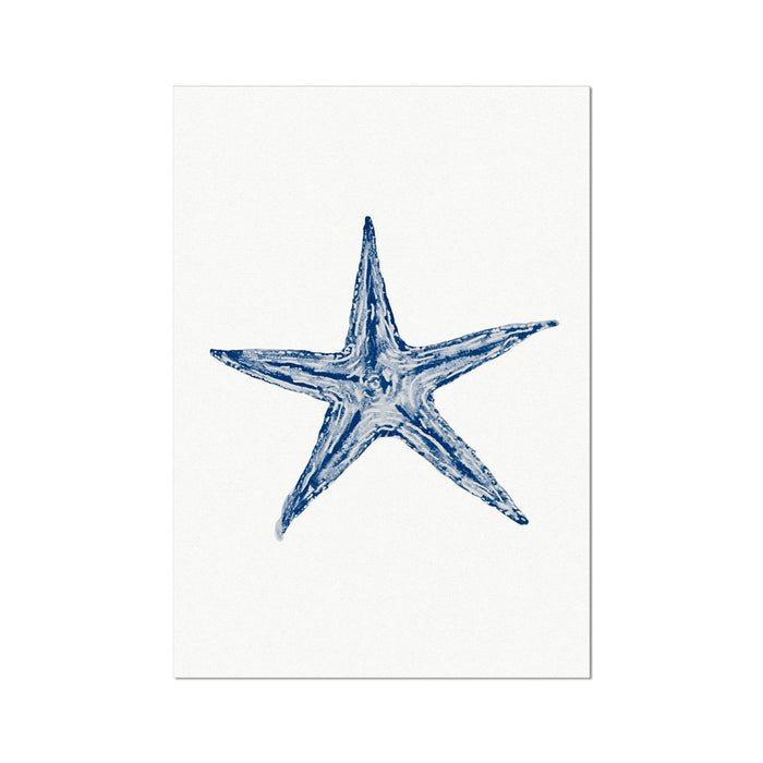 A framed art print of a blue watercolor painting of a starfish.