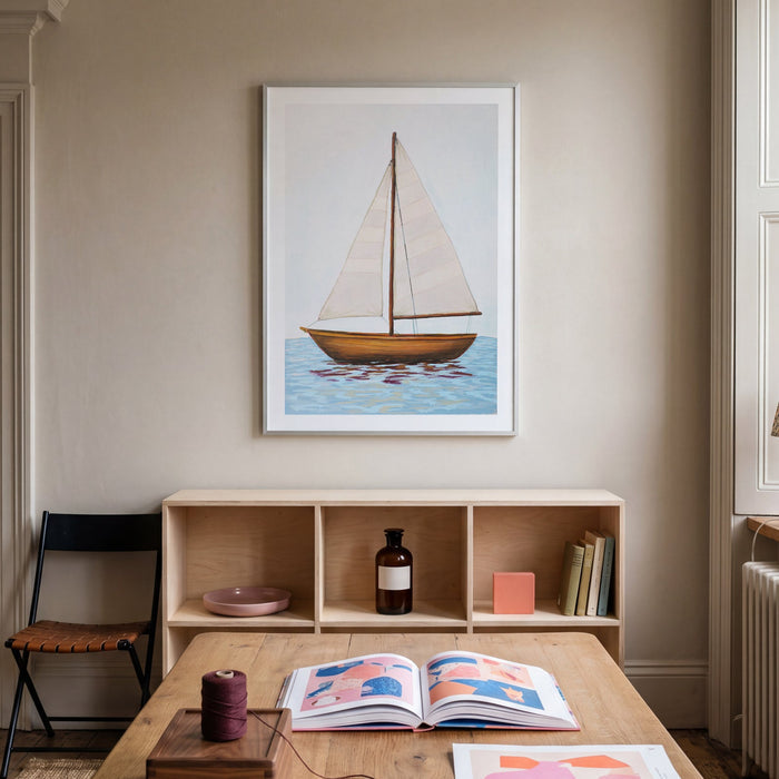 Room interior with a wooden table, bookshelf, and wall art of a sailboat.