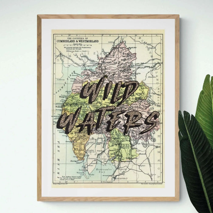 A vintage map art print of the Lake District with playful typography overlaying the map features.